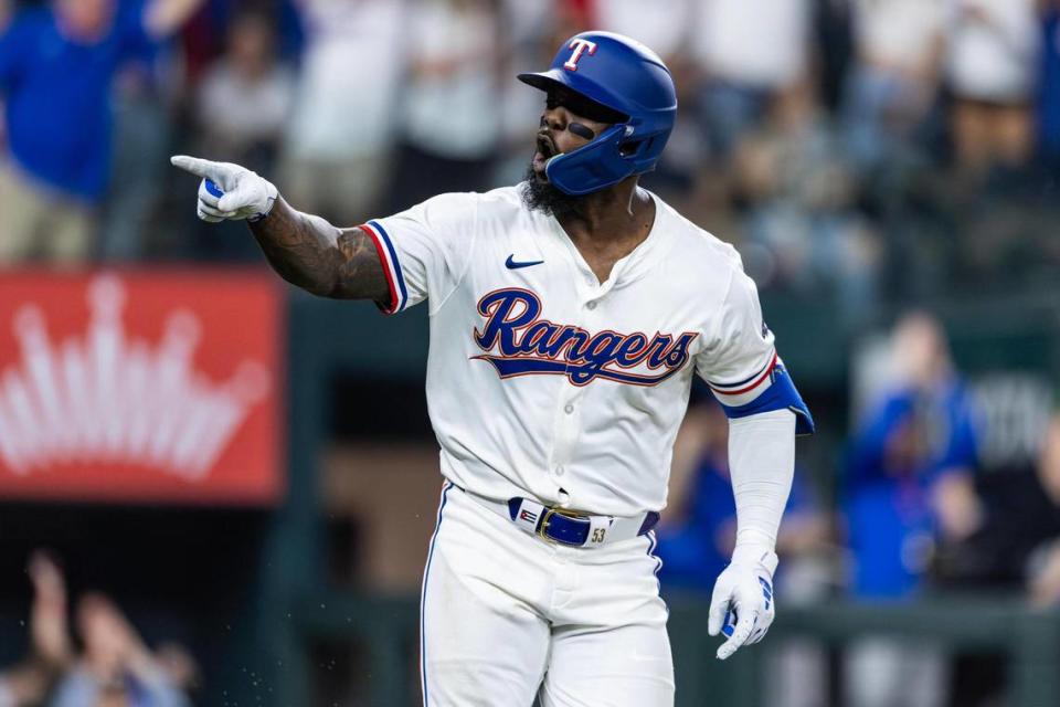 Texas Rangers outfielder Adolis Garcia (53) celebrates after hitting his first home run of the season in the sixth inning in their season opener against the Chicago Cubs at Globe Life Field in Arlington on Thursday, March 28, 2024. Chris Torres/ctorres@star-telegram.com