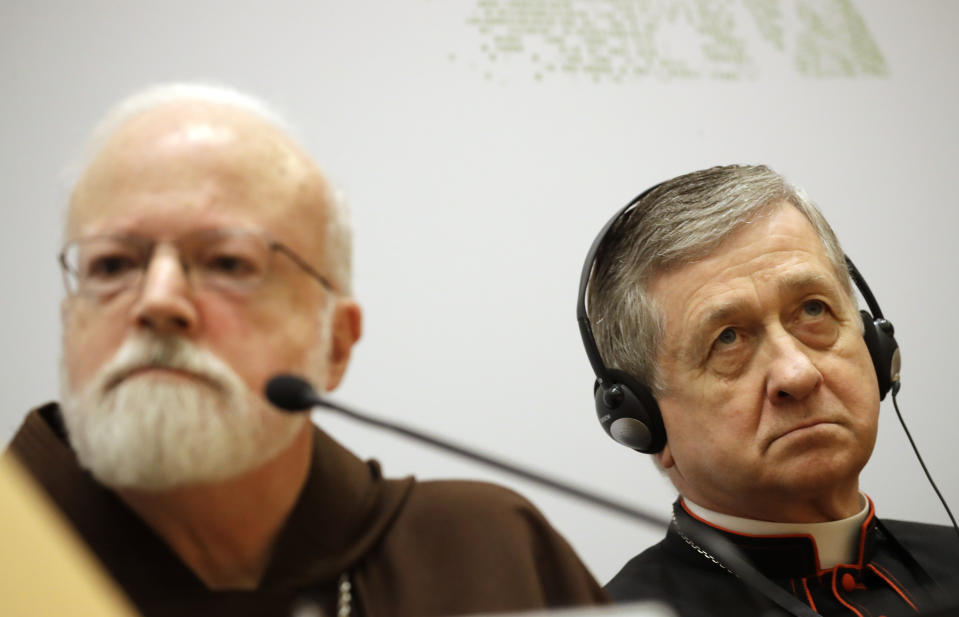 Chicago Archbishop Cardinal Blase J. Cupich, right, and Cardinal Sean Patrick O'Malley, listen to reporters' questions at a media briefing during a four-day sex abuse summit called by Pope Francis, in Rome, Friday, Feb. 22, 2019. Cardinals attending Pope Francis' summit on preventing clergy sex abuse called Friday for a new culture of accountability in the Catholic Church to punish bishops and religious superiors when they fail to protect their flocks from predator priests. (AP Photo/Alessandra Tarantino)