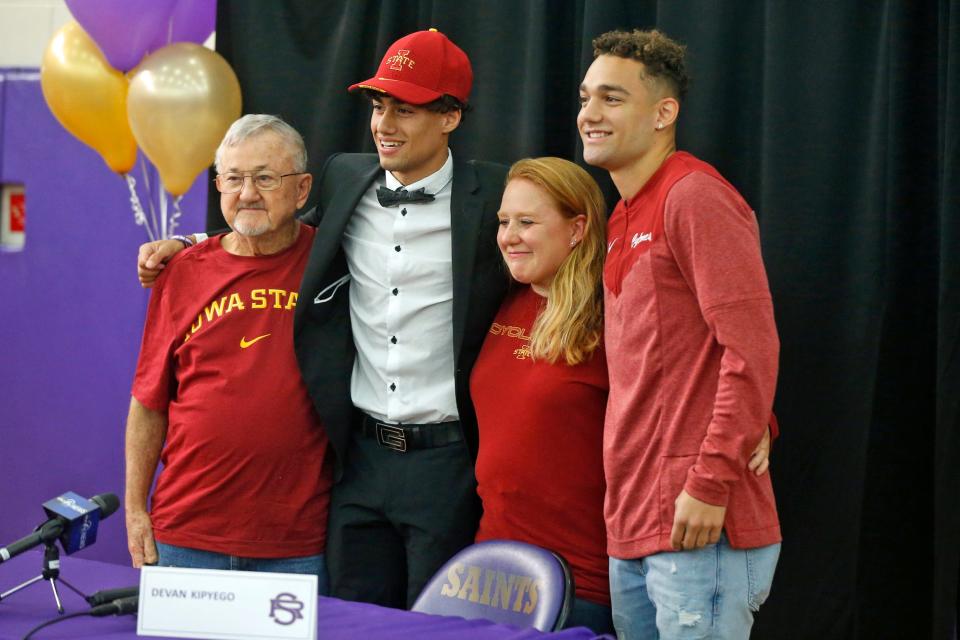 Devan Kipyego (second from left) poses with his family following his Signing Day ceremony where Kipyego announced he would be joining brother Darius (far right) at Iowa State University.