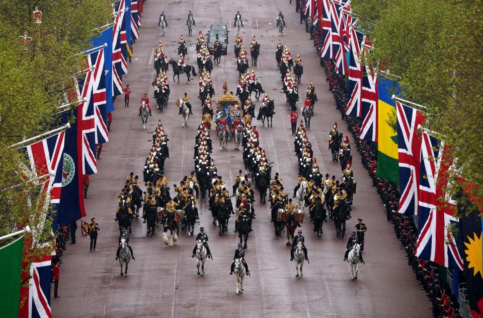 <p>Britain's King Charles III and Britain's Camilla, Queen Consort travel in the Diamond State Coach, in the 'King's Procession', a journey of two kilometres from Buckingham Palace to Westminster Abbey in central London on May 6, 2023, ahead of their coronations. - The set-piece coronation is the first in Britain in 70 years, and only the second in history to be televised. Charles will be the 40th reigning monarch to be crowned at the central London church since King William I in 1066. Outside the UK, he is also king of 14 other Commonwealth countries, including Australia, Canada and New Zealand. Camilla, his second wife, will be crowned queen alongside him and be known as Queen Camilla after the ceremony. (Photo by Gareth Fuller / POOL / AFP) (Photo by GARETH FULLER/POOL/AFP via Getty Images)</p> 