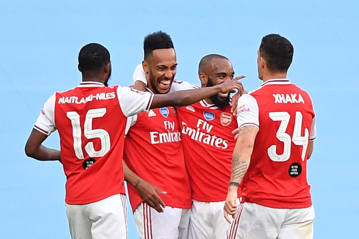 Arsenal's Gabonese striker Pierre-Emerick Aubameyang (2L) celebrates scoring the opening goal during the English FA Cup semi-final football match between Arsenal and Manchester City at Wembley Stadium in London, on July 18, 2020. (Photo by JUSTIN TALLIS / POOL / AFP) / NOT FOR MARKETING OR ADVERTISING USE / RESTRICTED TO EDITORIAL USE (Photo by JUSTIN TALLIS/POOL/AFP via Getty Images)