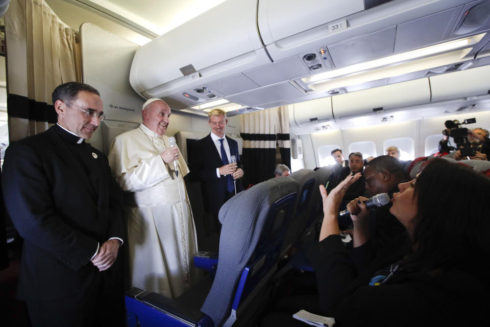 Pope Francis listens reporters questions during his flight from Antamanarivo to Rome, Tuesday, Sept. 10, 2019, after his seven-day pastoral trip to Mozambique, Madagascar, and Mauritius. (AP Photo/Alessandra Tarantino)