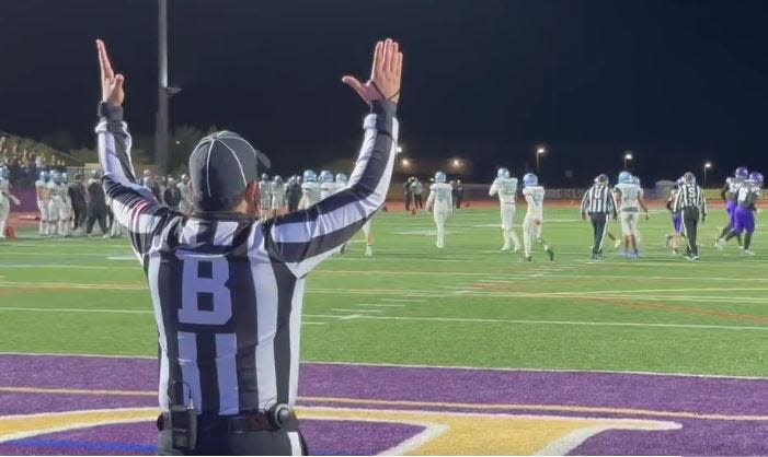 An official signals a Notre Dame field goal is good during the Saints 5A semifinal game against the Cactus Cobras. Dec. 2, 2022.