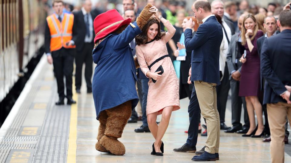 The Princess of Wales dances with a mascot