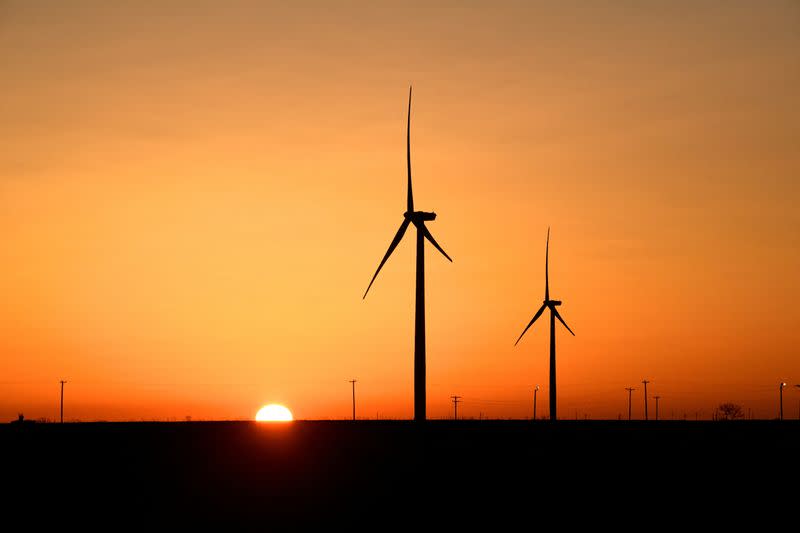 FILE PHOTO: Wind turbines operate at sunrise in Texas