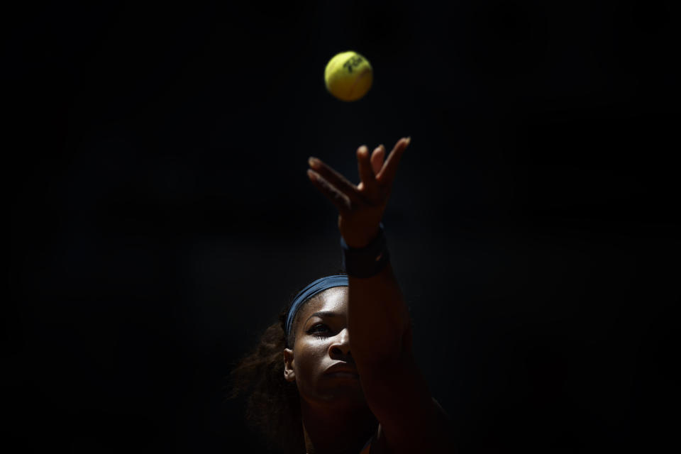 FILE - Serena Williams from U.S. returns the ball to Sara Errani from Italy during the Madrid Open tennis tournament, in Madrid Saturday, May 11, 2013. After nearly three decades in the public eye, few can match Serena Williams' array of accomplishments, medals and awards. Through it all, the 23-time Grand Slam title winner hasn't let the public forget that she's a Black American woman who embraces her responsibility as a beacon for her people. (AP Photo/Daniel Ochoa de Olza, File)