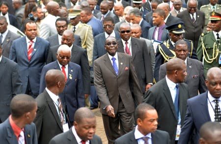 FILE PHOTO: Zimbabwe's President Mugabe, Mozambique's President Guebuza, Swaziland's King Mswati III and Congo's President Kabila arrive with other regional leaders for a summit of the 15-nation Southern African Development Community in Maputo