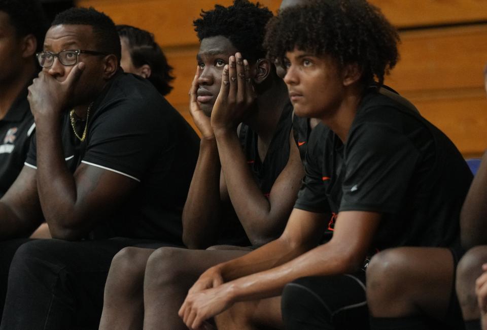 Lovinske Louis, center, of the John I. Leonard basketball team, looks on during the game against Cardinal Newman. Louis plays with the help of an interpreter to help him with his hearing disability. Friday, January 12, 2024 in West Palm Beach.