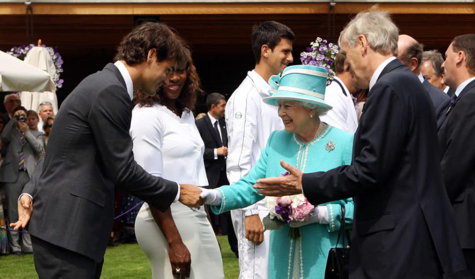Roger Federer meets Queen Elizabeth II at Wimbledon Credit: PA Images