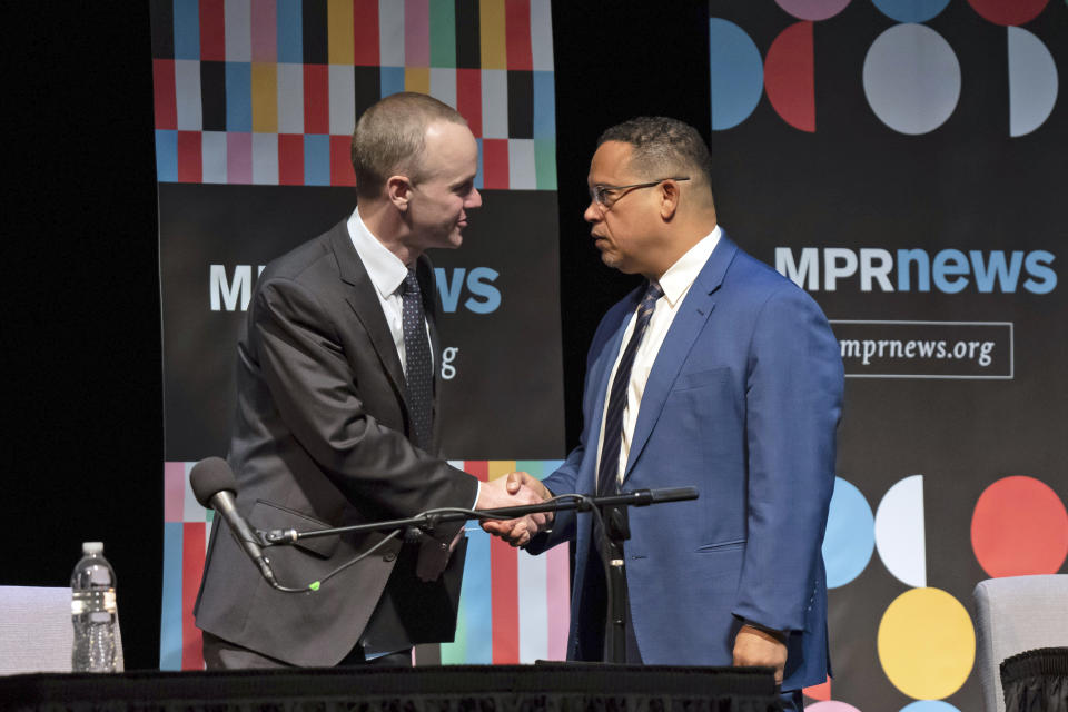 Republican challenger Jim Schultz, left, and Democratic Attorney General Keith Ellison, shake hands before a debate for Minnesota Attorney General, Friday, Oct. 14, 2022 St. Paul, Minn, Minn. (Glen Stubbe/Star Tribune via AP)