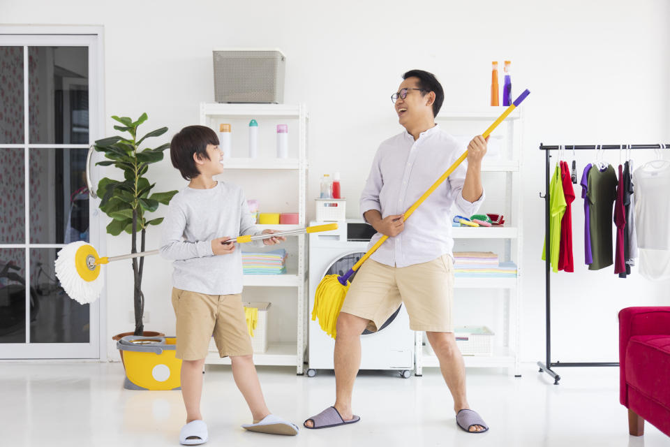 Father and son doing housework. PHOTO: Getty Images