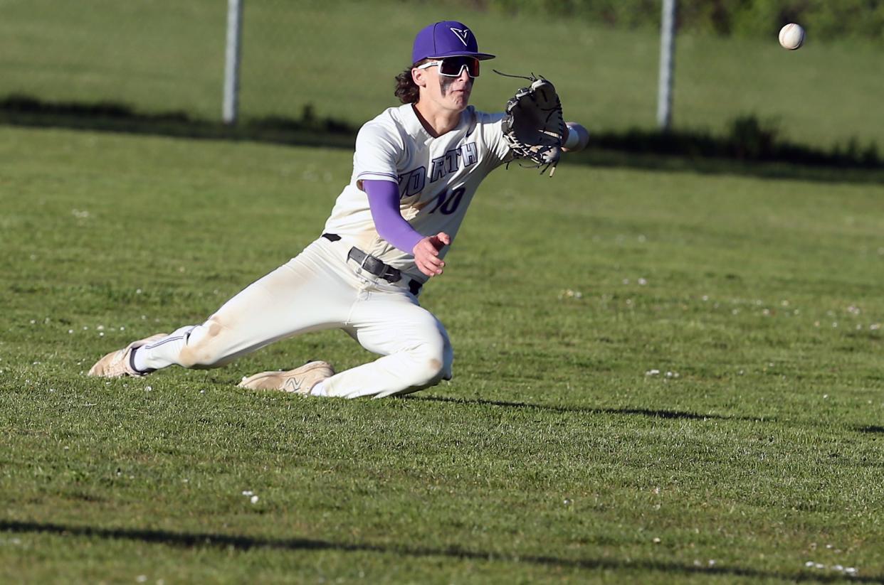 North Kitsap’s Jonathan Bourque (10) lays out to catch a fly ball for a Port Angeles out on Tuesday, April 30, 2024. North Kitsap won the game 5-2.