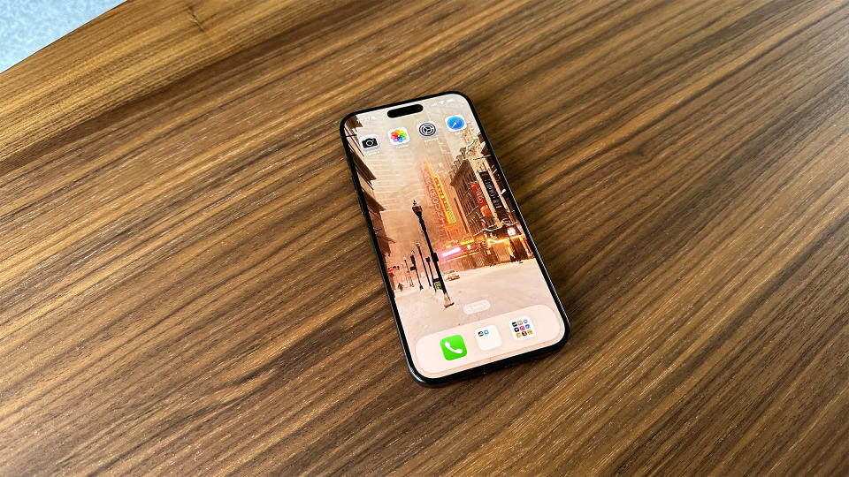 Apple iPhone 15 Pro Max on a wooden table