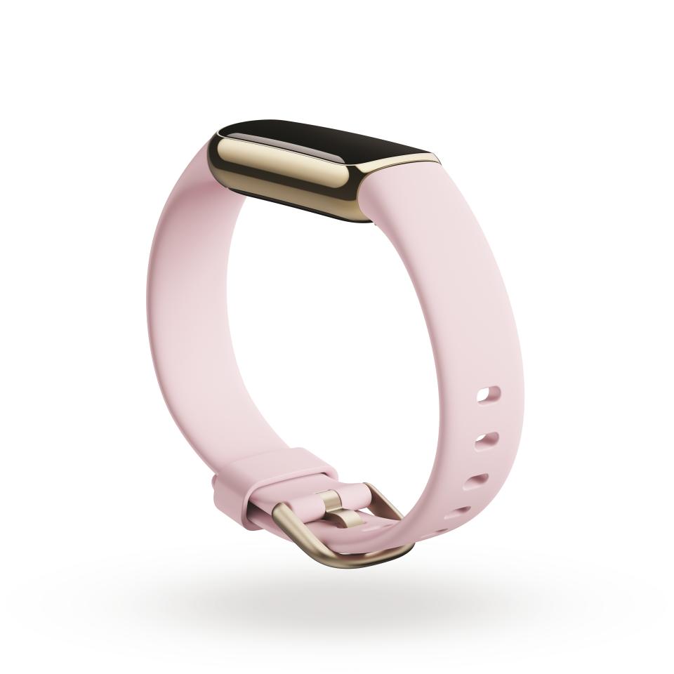 <p>Product render of Fitbit Luxe, dramatic view, in Peony and Soft Gold.</p> 