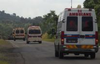 Ambulances drive towards an area where the stand-off with Filipino Sulu gunmen and Malaysian security forces was taking place in Tanduo village on March 5, 2013. Malaysian security forces launched an assault on March 5 to clear out armed Filipino intruders engaged in a three-week incursion that has left 27 people dead. AFP PHOTO / MOHD RASFAN