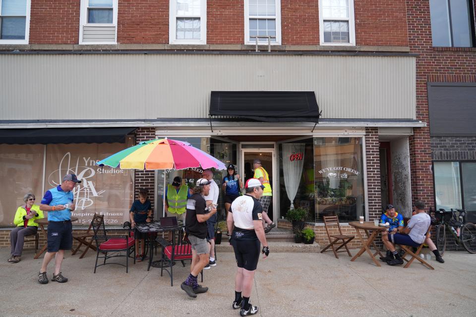 Riders stop at Sisters in Cheese in Madrid during the RAGBRAI route inspection ride, Wednesday, June 7, 2023. 