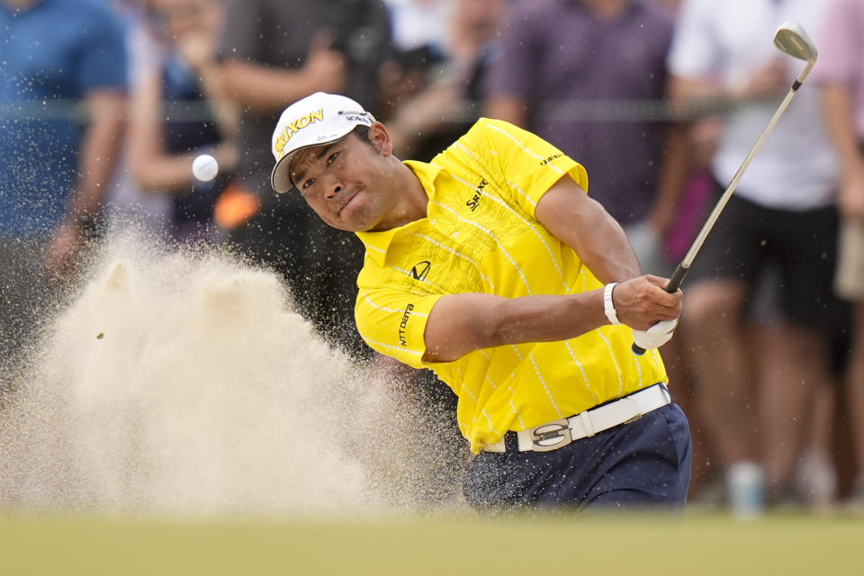 Hideki Matsuyama, of Japan, hits from the bunker on the 12th hole during the final round of the U.S. Open golf tournament Sunday, June 16, 2024, in Pinehurst, N.C. (AP Photo/Frank Franklin II)