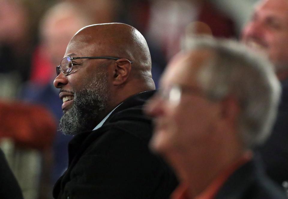 2022 inductee Ricky Powers smiles as he listens to old football stories during the 2023 Akron Public Schools Athletics Hall of Fame induction ceremony at House Three Thirty on Oct. 21 in Akron.