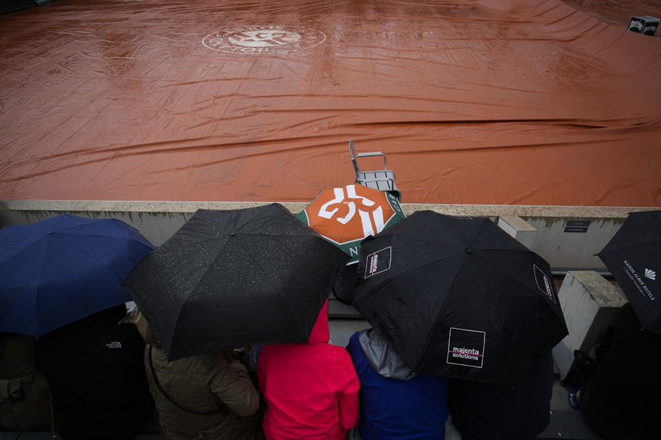 Rain suspended first round matches at the French Open tennis tournament in Roland Garros stadium in Paris, France, Monday, May 23, 2022. (AP Photo/Christophe Ena)