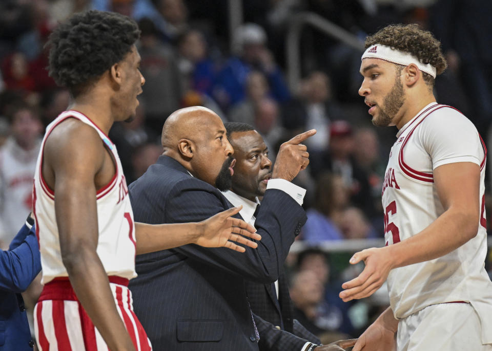 Indiana head coach Mike Woodson, second from left, instructs his players against Kent State during the first half of a first-round college basketball game in the NCAA Tournament, Friday, March 17, 2023, in Albany, N.Y. (AP Photo/Hans Pennink)