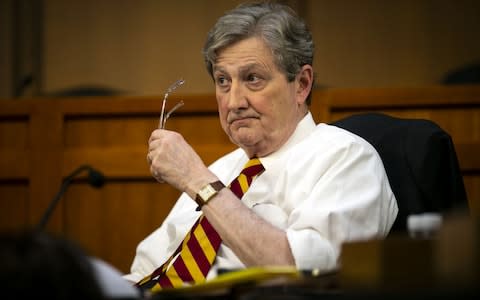 Senator John Kennedy, a Republican from Louisiana, listens as Zuckerberg speaks - Credit: Bloomberg