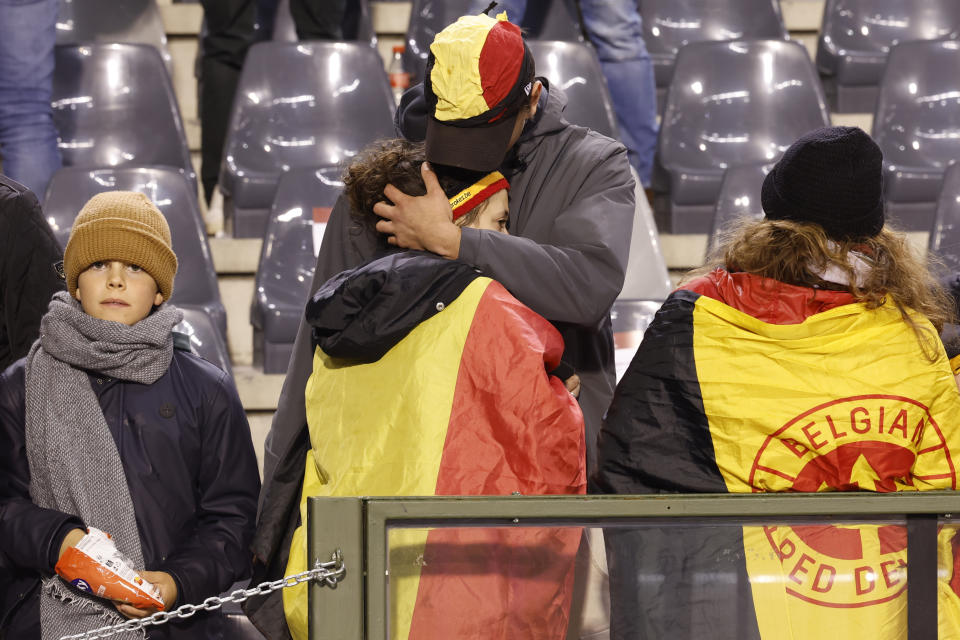Supporters are on the stands after suspension of the Euro 2024 group F qualifying soccer match between Belgium and Sweden at the King Baudouin Stadium in Brussels, Monday, Oct. 16, 2023. The match was abandoned at halftime after two Swedes were killed in a shooting in central Brussels before kickoff. (AP Photo/Geert Vanden Wijngaert)