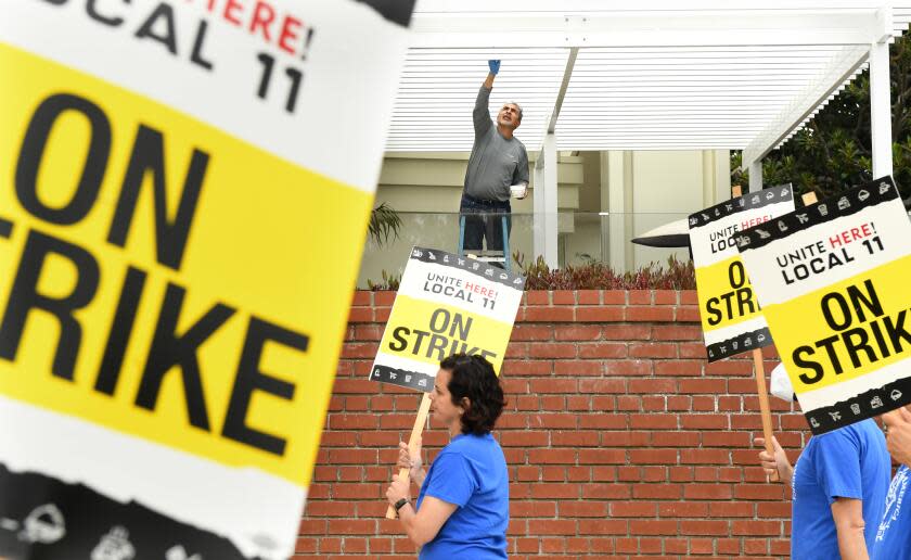 Santa Monica, California July 3, 2023-Hotel workers protest outside the Fairmont Miramar Hotel in Santa Monica Monday. Workers at dozens of major Southland hotels remain on strike in an effort to secure higher pay and improvements in healthcare and retirement benefits. (Wally Skalij/Los Angles Times)