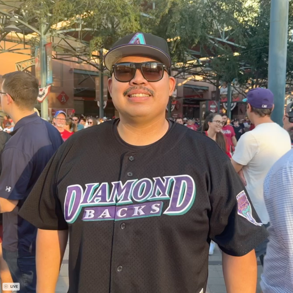 Henry Camales poses for a photo after Diamondbacks beat the Phillies in Game 3 on Oct. 19, 2023.