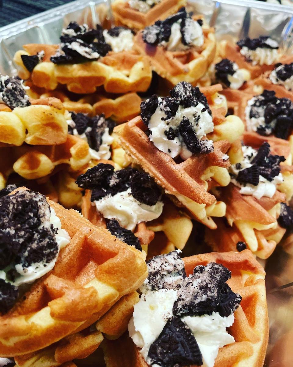 Oreo waffles are just one item on the menu at Black Iron Waffles food trailer. They can be made with either chocolate or vanilla waffles and then topped with pudding or whipped cream and Oreo cookies.