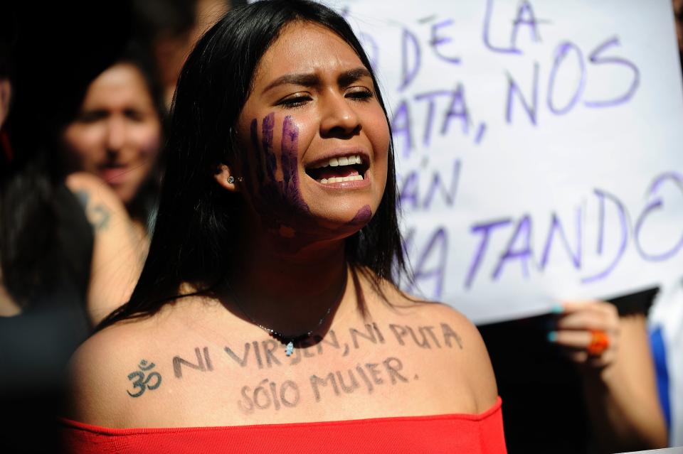A woman in Mexico City protests on October 19 with the words "Not a virgin, not a slut, just a woman."