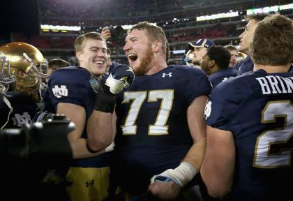 Matt Hegarty #77 of the Notre Dame Fighting Irish celebrates after beating the LSU Tigers in the Music City Bowl at LP Field on December 30, 2014 in Nashville, Tennessee. (Photo by Andy Lyons/Getty Images)