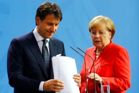 German Chancellor Angela Merkel and Italian Prime Minister Giuseppe Conte hold a news conference at the chancellery in Berlin, Germany, June 18, 2018. REUTERS/Hannibal Hanschke