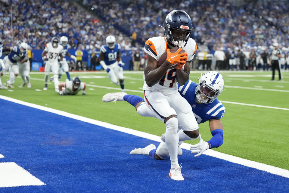 Denver Broncos wide receiver Marvin Mims Jr. (19) makes a catch for a touchdown against the Indianapolis Colts during the second quarter of a preseason NFL football game, Sunday, Aug. 11, 2024, in Westfield, Ind. (AP Photo/AJ Mast)