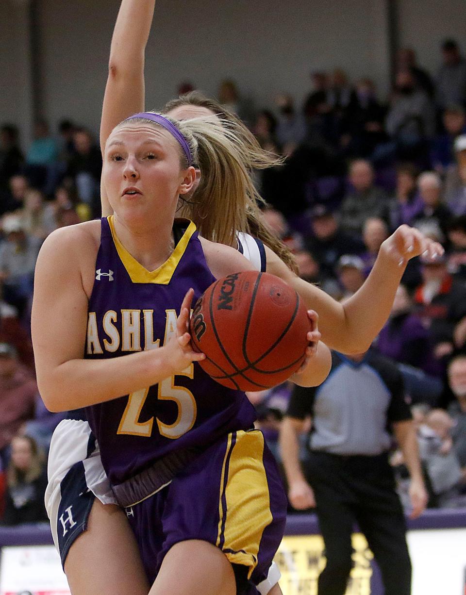 Ashland University's Karlee Pireu (25) drives past Hillsdale College's Sydney Mills during their NCAA college women's basketball game Saturday, Feb. 26, 2022 at Kates Gymnasium. TOM E. PUSKAR/TIMES-GAZETTE.COM