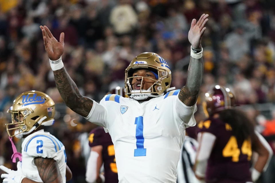 UCLA quarterback Dorian Thompson-Robinson celebrates his touchdown run against Arizona State during the first half of an NCAA college football game in Tempe, Ariz., Saturday, Nov. 5, 2022. (AP Photo/Ross D. Franklin)