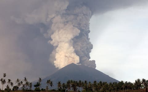 A view of the Mount Agung volcano erupting in Karangasem, Bali, on Monday - Credit: AP