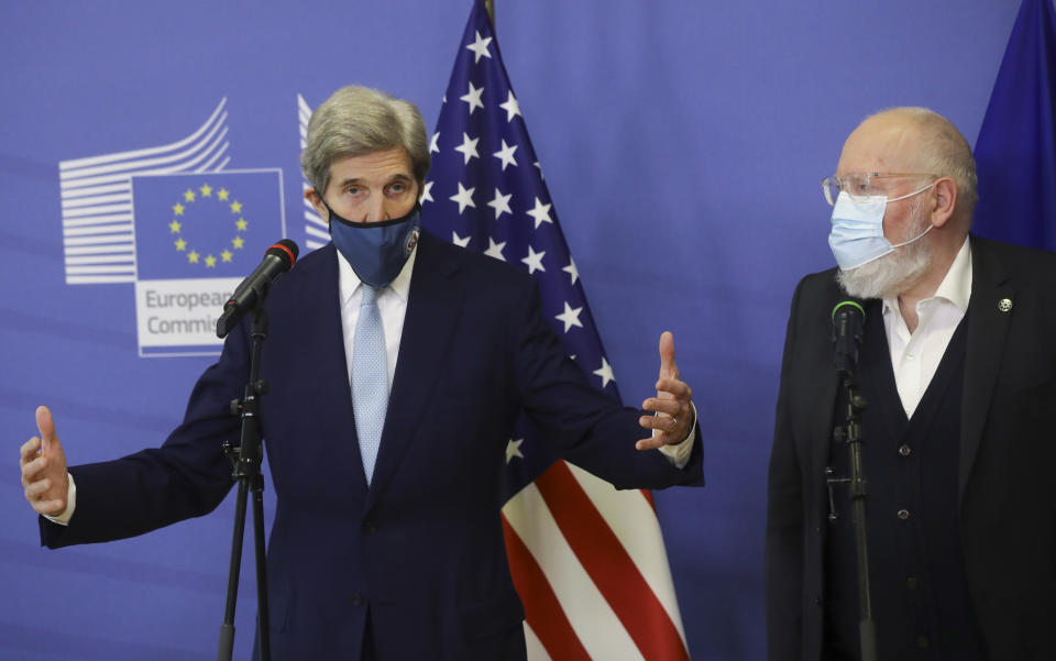 European Commissioner for European Green Deal Frans Timmermans, right, and U.S Special Presidential Envoy for Climate John Kerry address a media conference at EU headquarters in Brussels, Tuesday, March 9, 2021. US special envoy for climate John Kerry traveled to Brussels Tuesday to discuss trans-Atlantic cooperation with European officials in the wake of President Joe Biden's decision to rejoin the global effort to curb climate change. (Olivier Hoslet, Pool via AP)