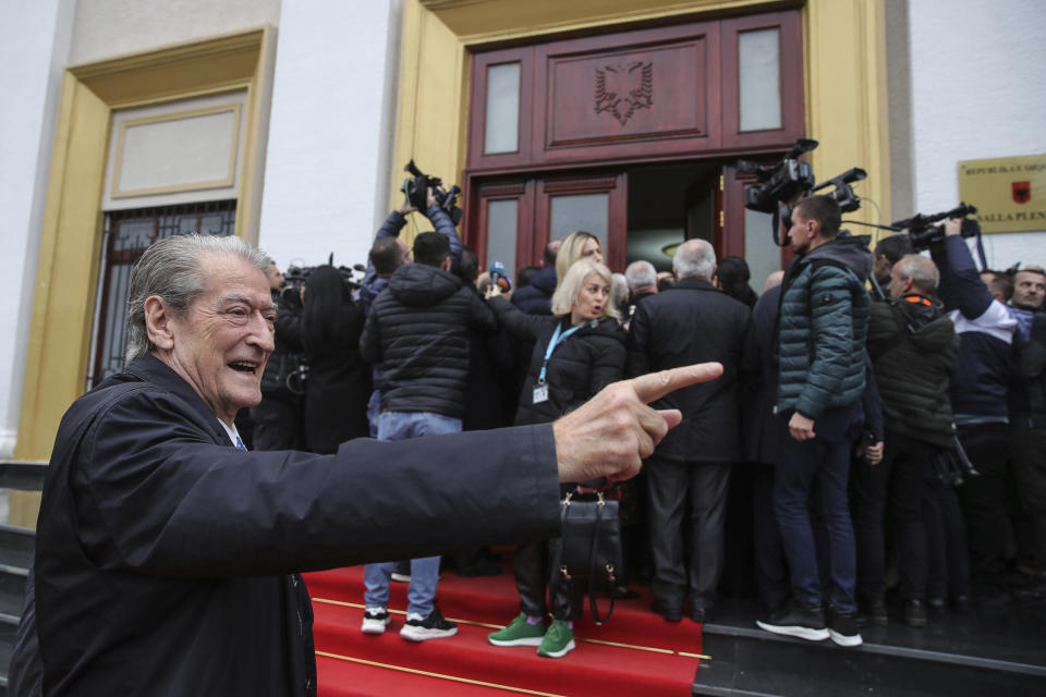 Sali Berisha, 79, the main leader of the center-right Democratic Party gestures outside the Parliament in Tirana, Albania, Thursday, Dec. 14, 2023. Lawmakers in Albania have gathered for a new session that the opposition tried to disrupt demanding the government to be investigated for alleged corruption. (AP Photo/Armando Babani)