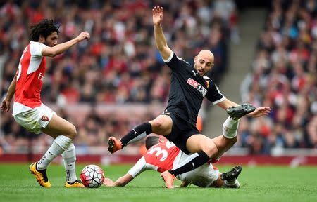 Football Soccer - Arsenal v Watford - Barclays Premier League - Emirates Stadium - 2/4/16 Arsenal's Francis Coquelin challenges Watford's Nordin Amrabat Reuters / Dylan Martinez Livepic EDITORIAL USE ONLY.