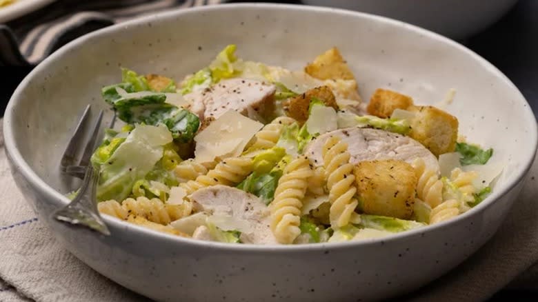 Chicken Caesar pasta salad in a ceramic bowl