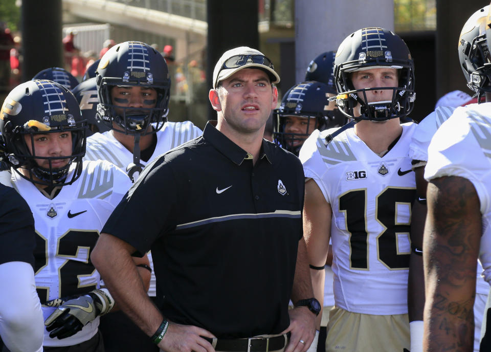 FILE - Then-Purdue interim coach Gerad Parker stands with players before the team's NCAA college football game against Nebraska in Lincoln, Neb., Oct. 22, 2016. Troy hired Notre Dame offensive coordinator Gerad Parker to be its next head coach on Monday, Dec. 18, 2023. Parker, 42, will replace Jon Sumrall, who left Troy earlier this month after two successful seasons to become head coach at Tulane. (AP Photo/Nati Harnik, File)