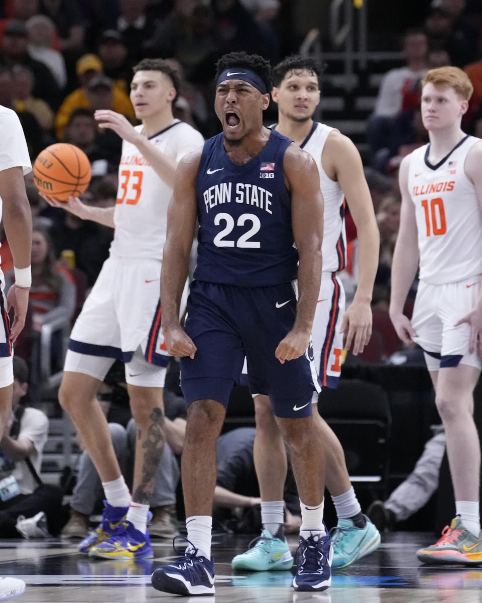 Penn State's Jalen Pickett (22) celebrates after scoring and getting fouled during the second half of an NCAA college basketball game against Illinois at the Big Ten men's tournament, Thursday, March 9, 2023, in Chicago. Penn State won 79-76. (AP Photo/Charles Rex Arbogast)