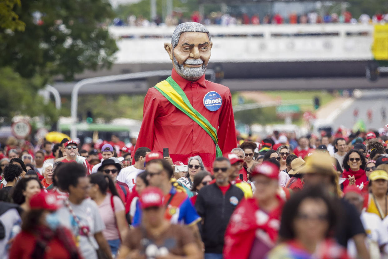Supporters of President-elect Luiz Inacio Lula da Silva gather to attend his inauguration along the central avenue in Brasilia, Brazil, Sunday, Jan. 1, 2023. (AP Photo/Gustavo Moreno)