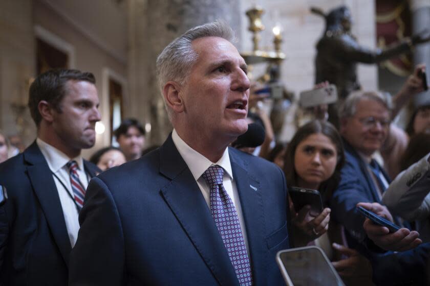 Speaker of the House Kevin McCarthy, R-Calif., stops for reporters' questions about passing a funding bill and avoiding a government shutdown, at the Capitol in Washington, Monday, Sept. 18, 2023. McCarthy is trying to win support from right-wing Republicans by including spending cuts and conservative proposals for border security and immigration. (AP Photo/J. Scott Applewhite)