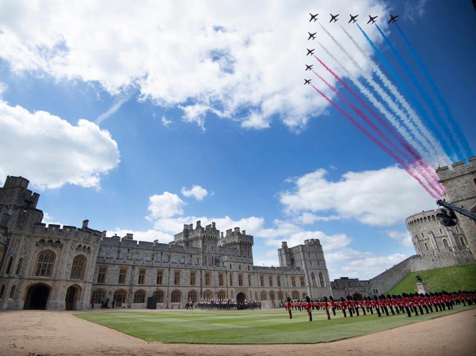 The Red Arrows conduct a flypast as Britain's Queen Elizabeth II watches a military ceremony to mark her official birthday at Windsor Castle on June 12, 2021 (POOL/AFP via Getty Images)