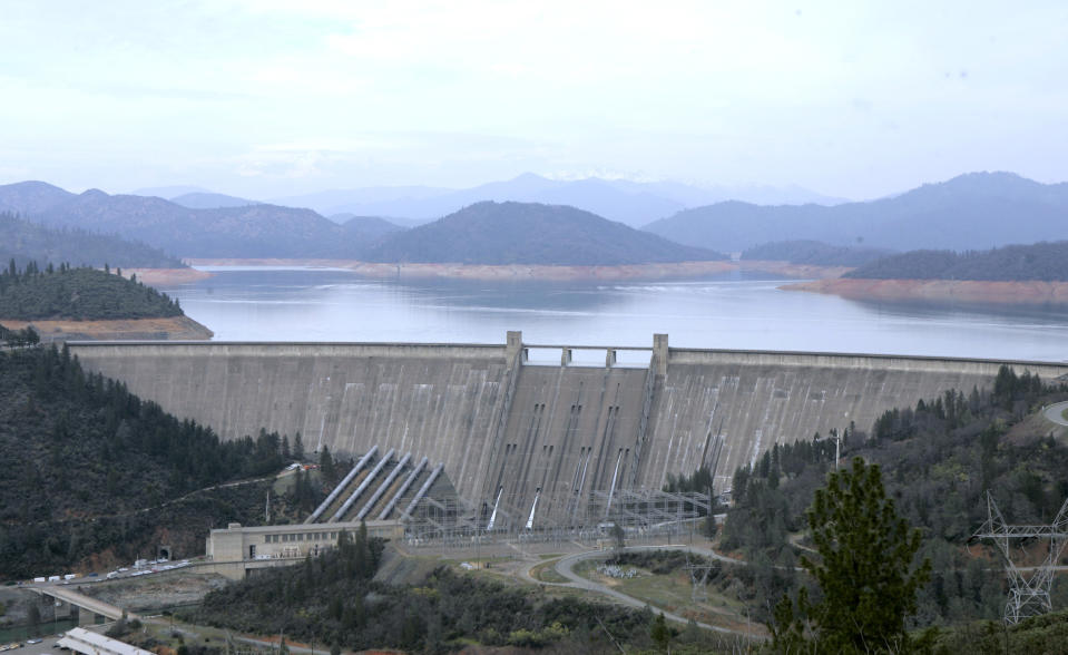 FILE - This Feb. 22, 2008 file photo shows the 602-foot, concrete Shasta Dam near Shasta, Calif. The U.S. Bureau of Reclamation announced, on Wednesday, Feb. 23, 2022, that it will not deliver any water to California farmers because of a severe drought. The decision will force many farmers to plant fewer crops in a region that supplies a quarter of the nation's food. (AP Photo/Rich Pedroncelli, File)