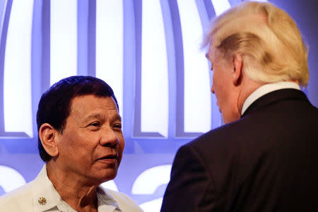Philippine President Rodrigo Duterte (L) talks to US President Donald J. Trump (R) before the opening ceremony of the 31st Association of Southeast Asian Nations (ASEAN) Summit in Manila, Philippines,13 November 2017. REUTERS/Mark R. Cristino/Pool
