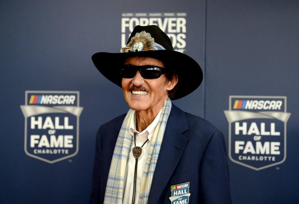 NASCAR legend and Hall of Fame member Richard Petty smiles for photographers as he walks the red carpet at the NASCAR Hall of Fame in Charlotte, NC on Friday, February 1, 2019. Petty is the ambassador of NASCAR race team Legacy Motor Club.