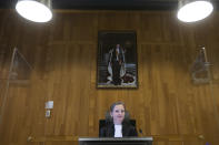 Judge Larisa Alwin opens the court case of Milieudefensie, the Dutch arm of the Friends of the Earth environmental organization, against Shell in The Hague, Netherlands, Tuesday, Dec. 1, 2020. A landmark legal battle opened as climate change activists in the Netherlands go to court seeking an order for energy giant Shell to rein in its carbon emissions. (AP Photo/Peter Dejong, Pool)