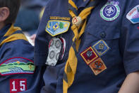 FILE- In this June 25, 2016, file photo, Cub Scouts watch a race during the Second Annual World Championship Pinewood Derby in New York's Times Square. In January 2020, the Boy Scouts of America will increase its annual youth membership fee by more than 80% as it faces a potentially ruinous wave of new sex-abuse lawsuits. (AP Photo/Mary Altaffer, File)